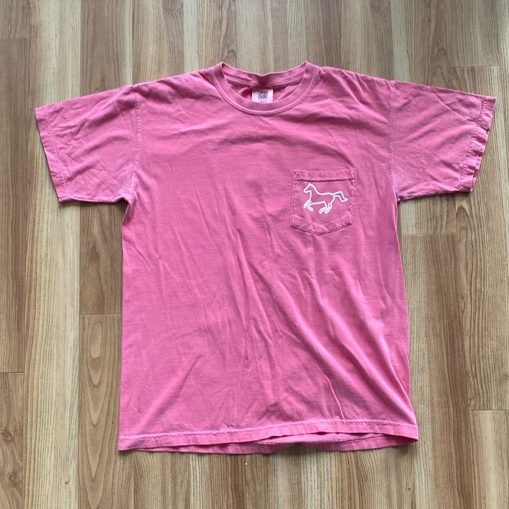 Pink pocket tee.